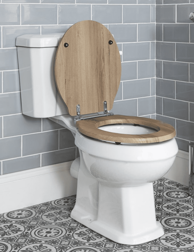 A toilet bowl with a wooden cover