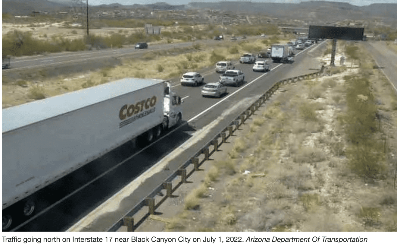 A road full of cars and trucks