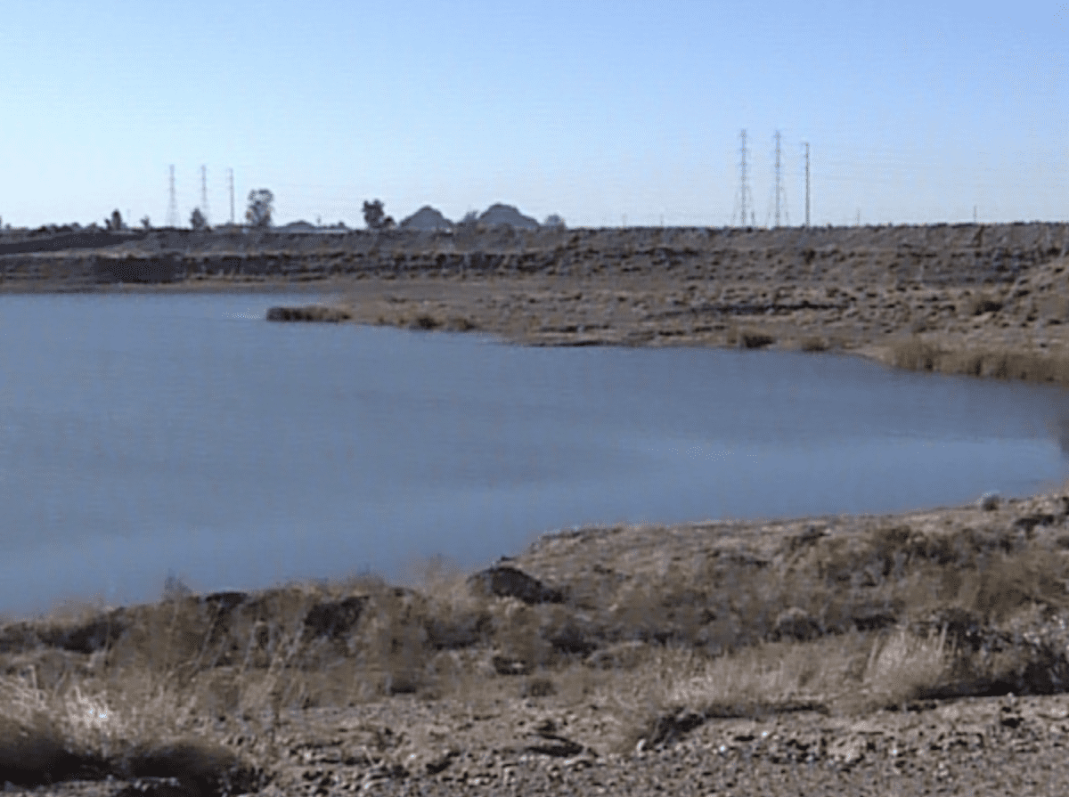 A river surrounded with a sand land