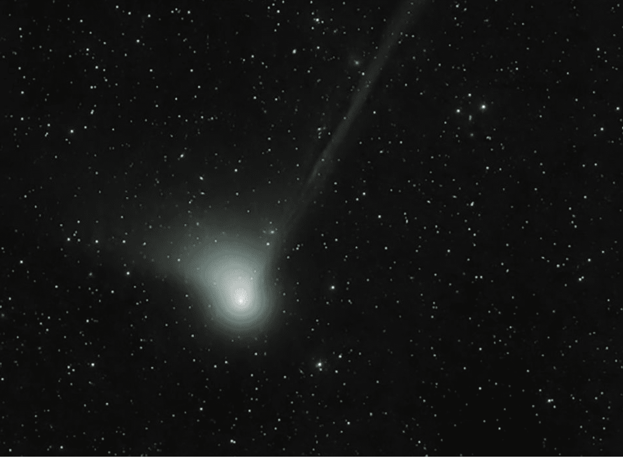 Comet with bright coma and long tail