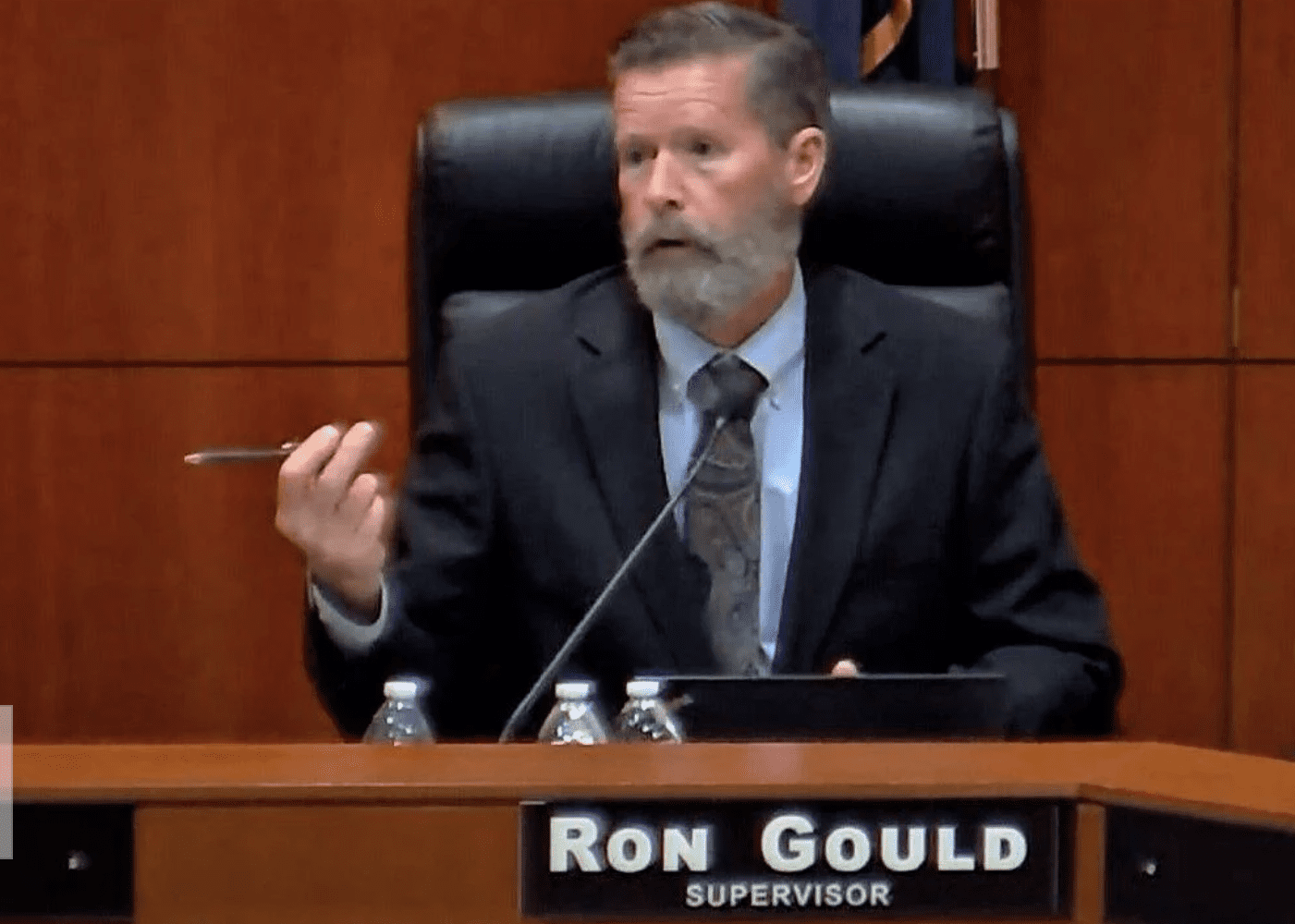 Ron Gould supervisor in black suit speaking