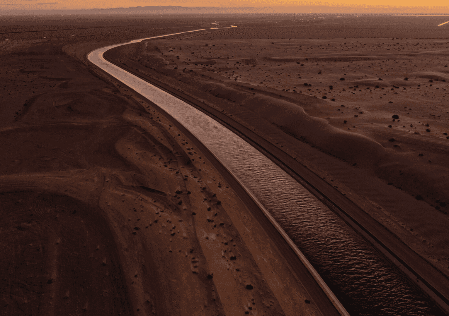 Aerial view of long desert irrigation canal