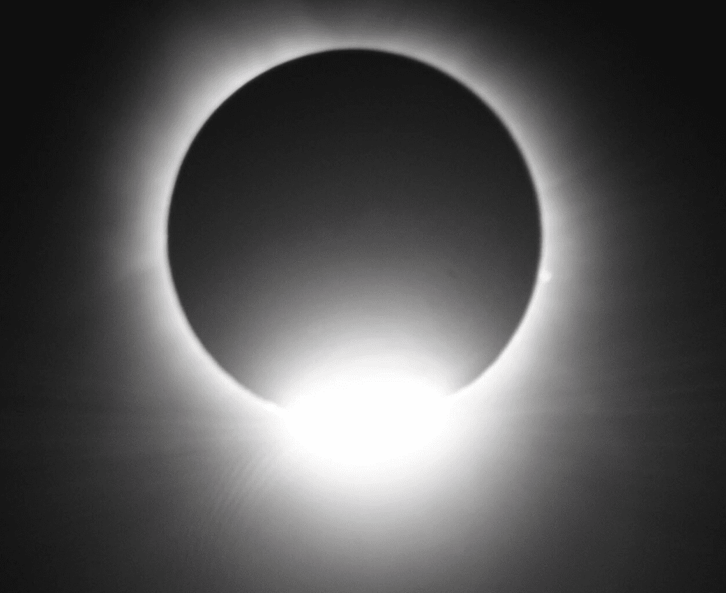 Solar eclipse with bright diamond ring corona