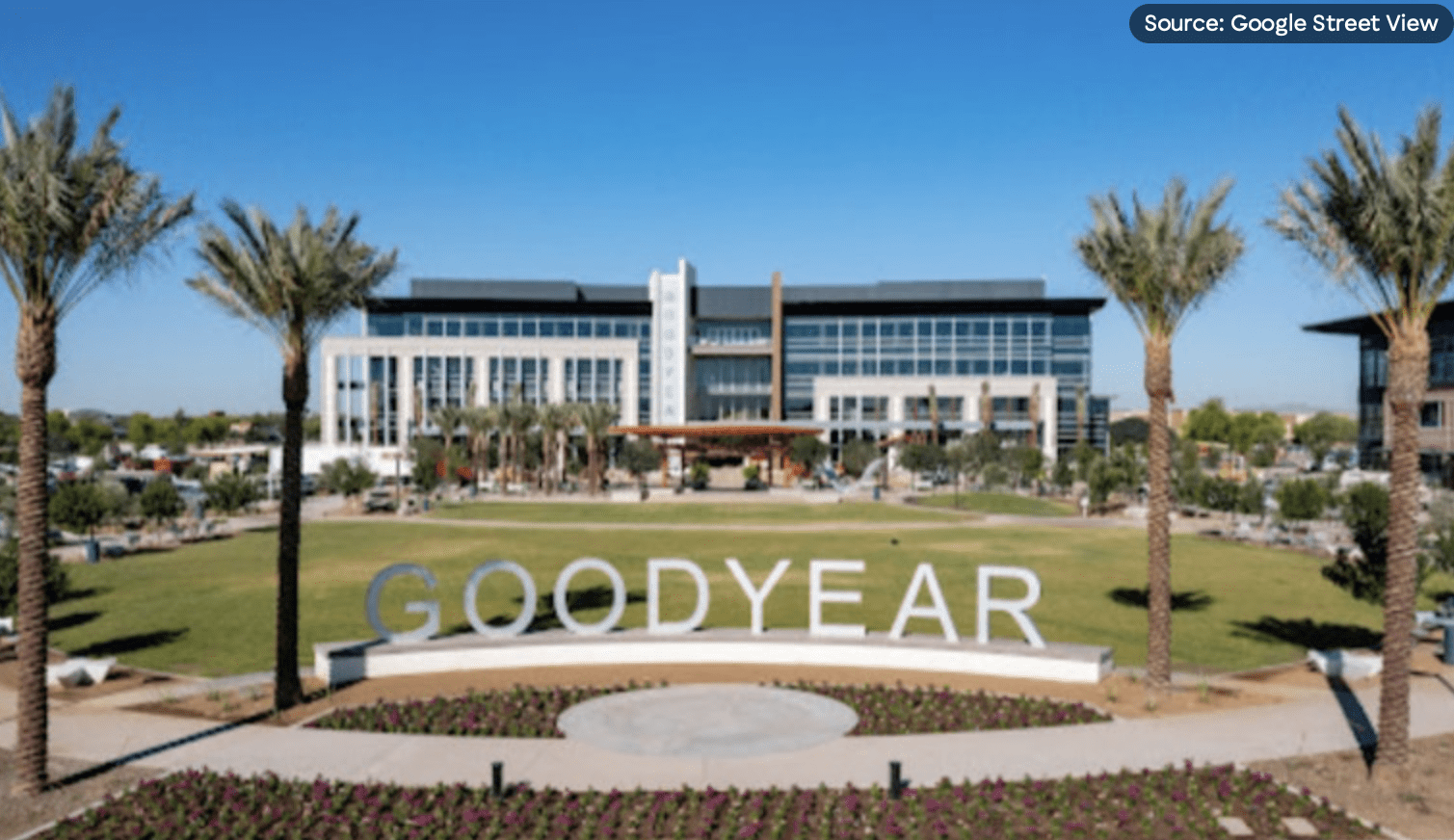 Goodyear sign and office buildings with palms