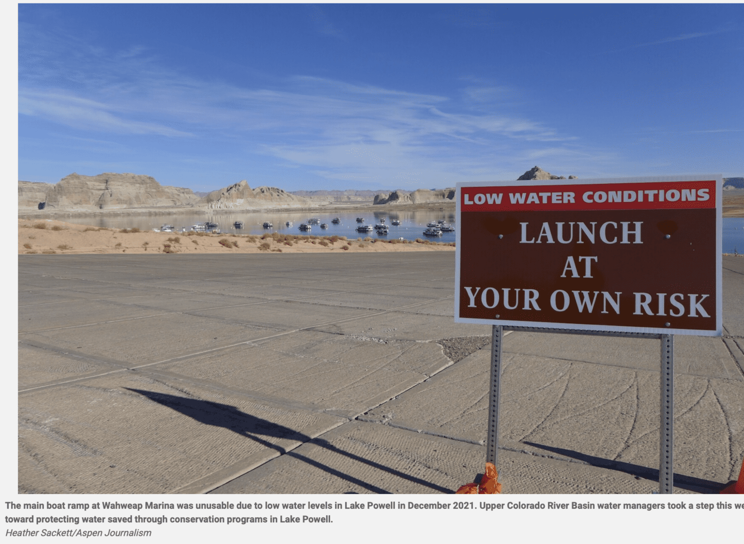Boat launch sign warning low water conditions