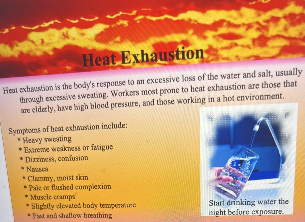 Heat exhaustion informational poster with symptoms