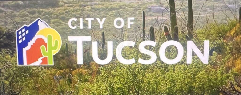 City of Tucson logo over desert landscape background