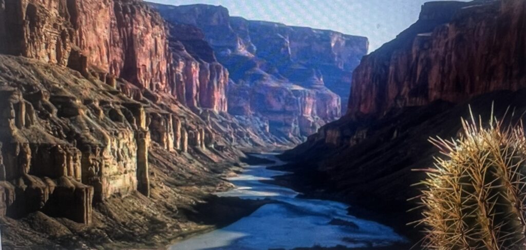 River winding through steep red rock canyon