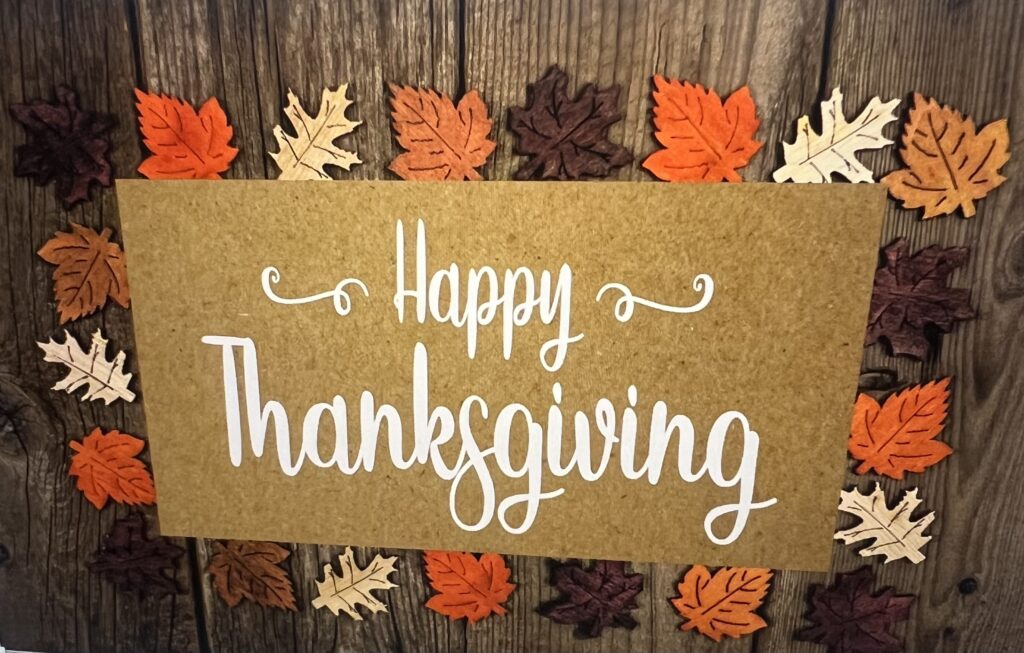 Happy Thanksgiving sign with autumn leaves