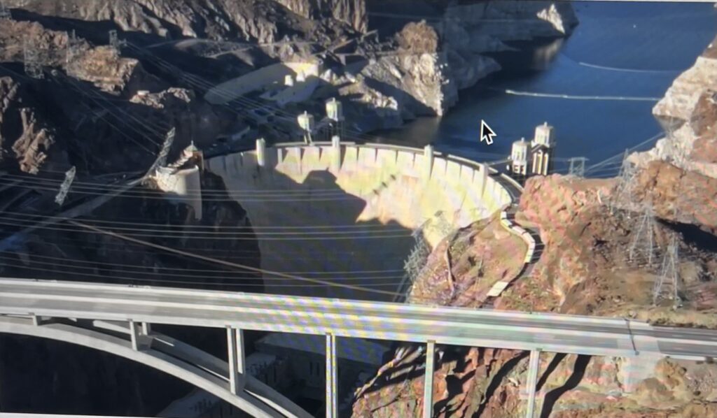 Hoover Dam with arched bridge in foreground