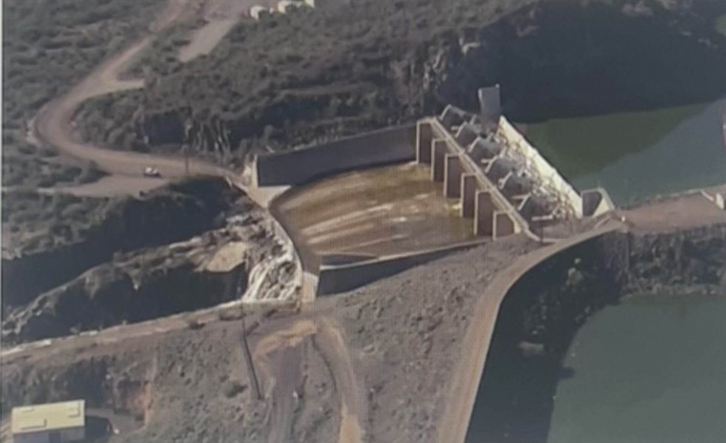 Aerial view of concrete dam and spillway