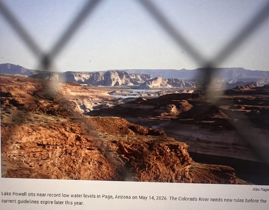 View of Lake Powell through chain-link fence
